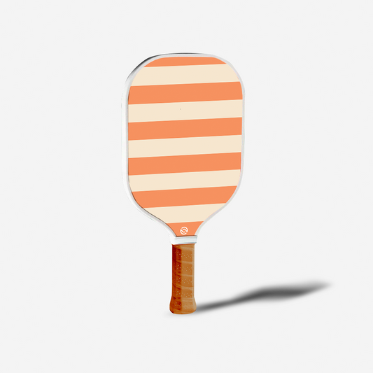 Striped paddle with wooden handle on a white background