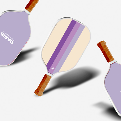 Three pickleball paddles with lavender and white stripes, displayed with the text 'OASIS' on the top surface.